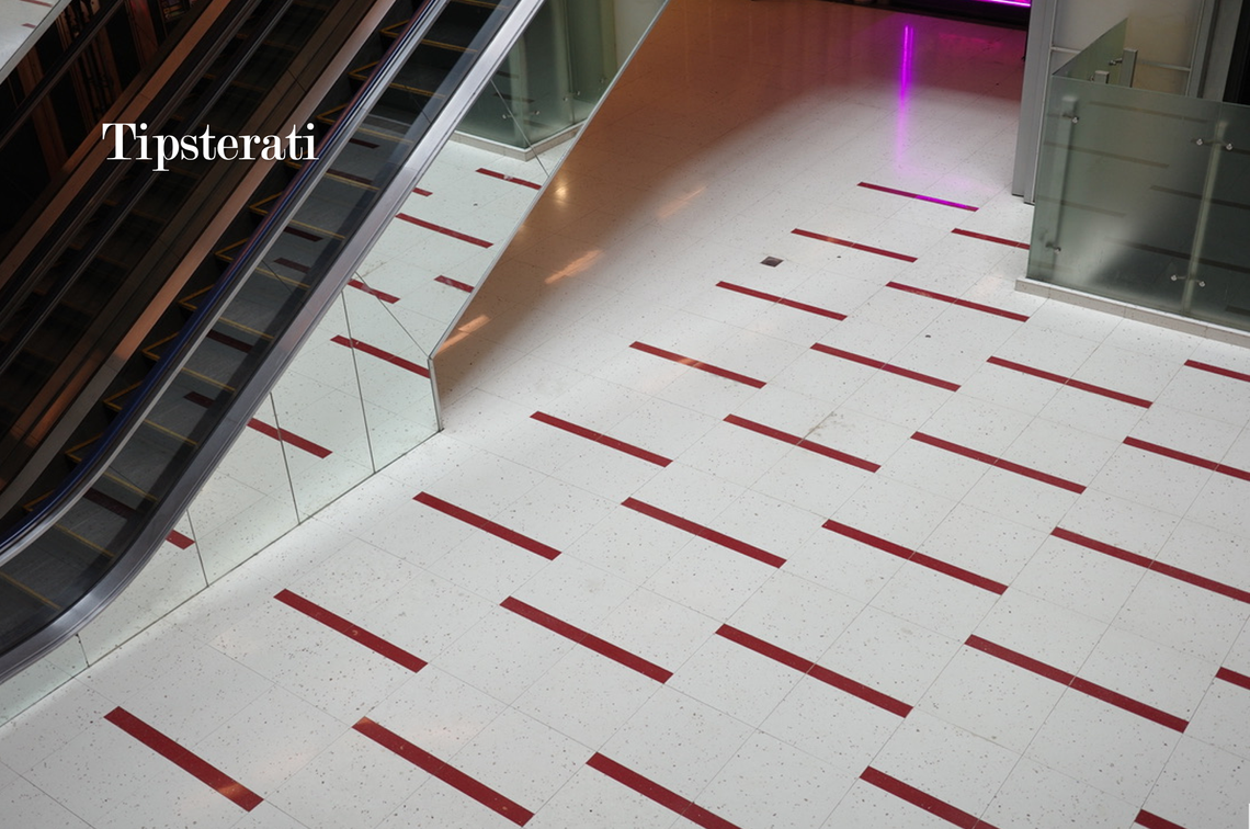 A view of the floor patterned with red lines. 