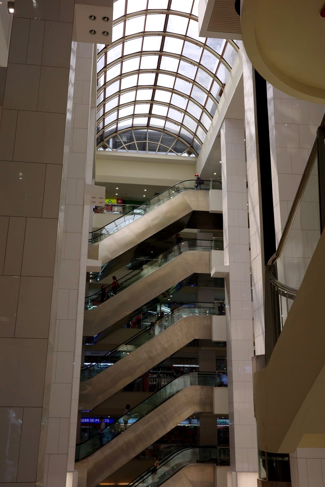 A stack of 5 escalators, one above another, in an atrium